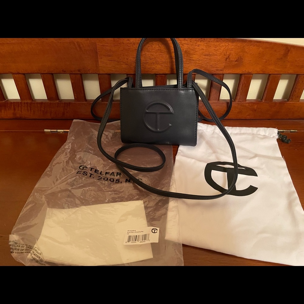 Gently used like new small navy Telfar shopping bag. With tags and packaging.